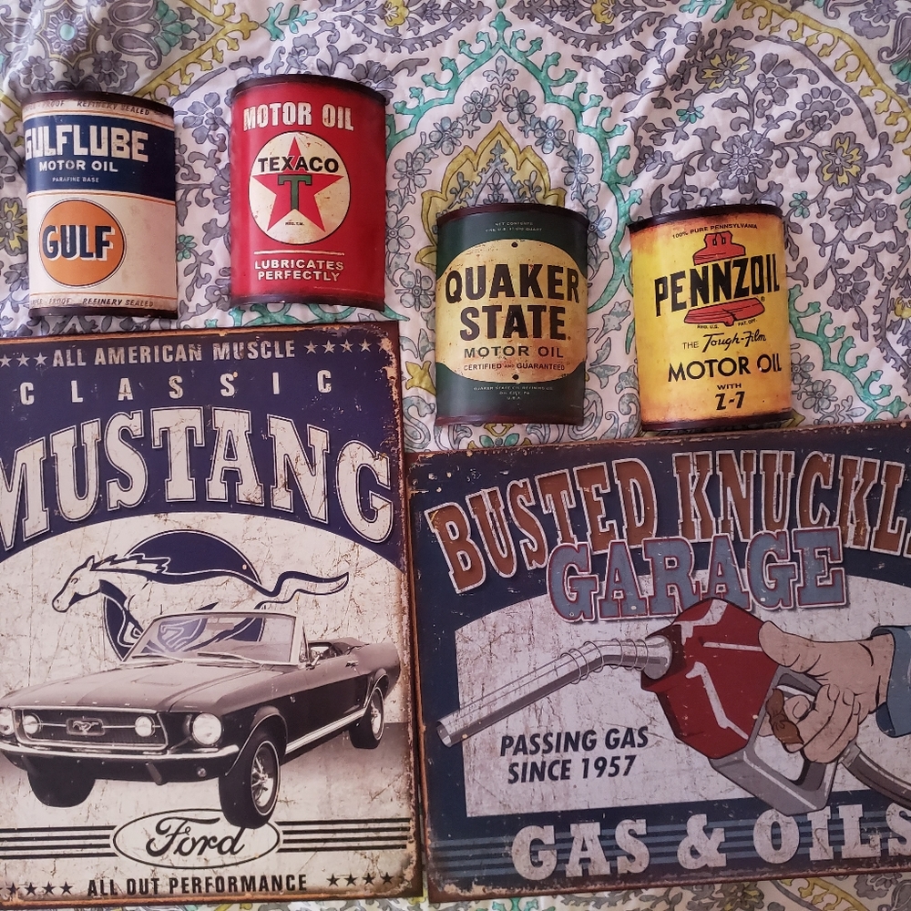 Vintage inspired metal sings and display oil cans